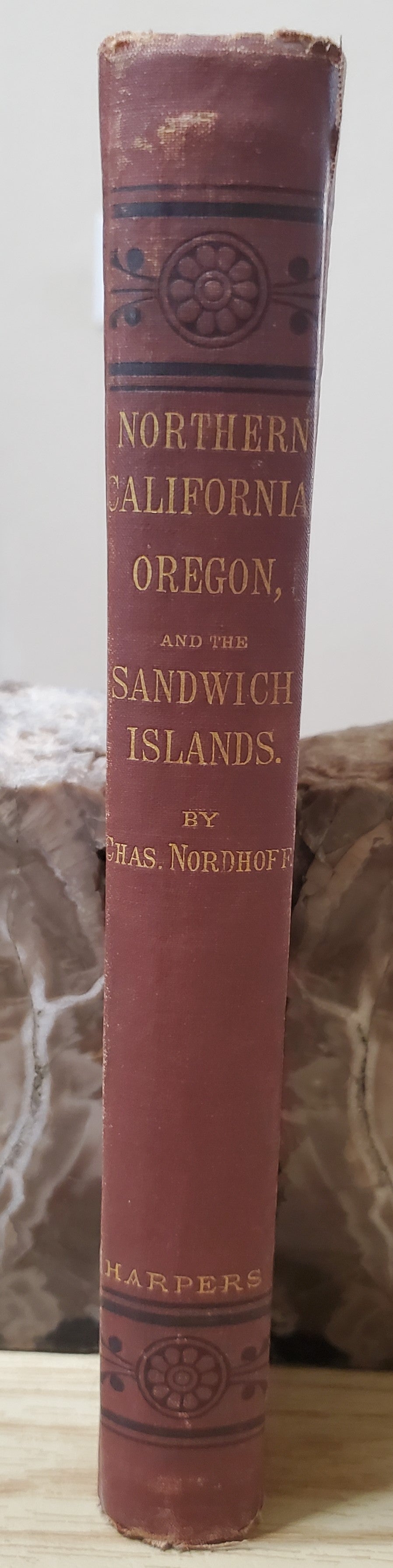 Nordhoff, Charles. Northern California, Oregon and the Sandwich Islands. 1874. 1st ed. Illus. Cloth, gilt. Cloth frayed, rubbed, bb-sized hole through first four pages, bookplate removed. VG