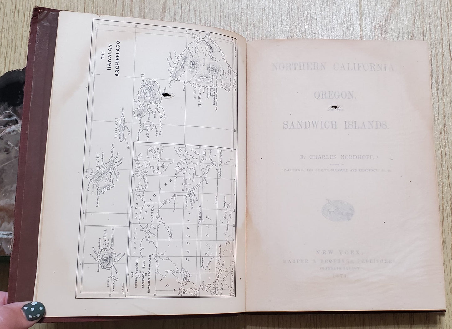 Nordhoff, Charles. Northern California, Oregon and the Sandwich Islands. 1874. 1st ed. Illus. Cloth, gilt. Cloth frayed, rubbed, bb-sized hole through first four pages, bookplate removed. VG