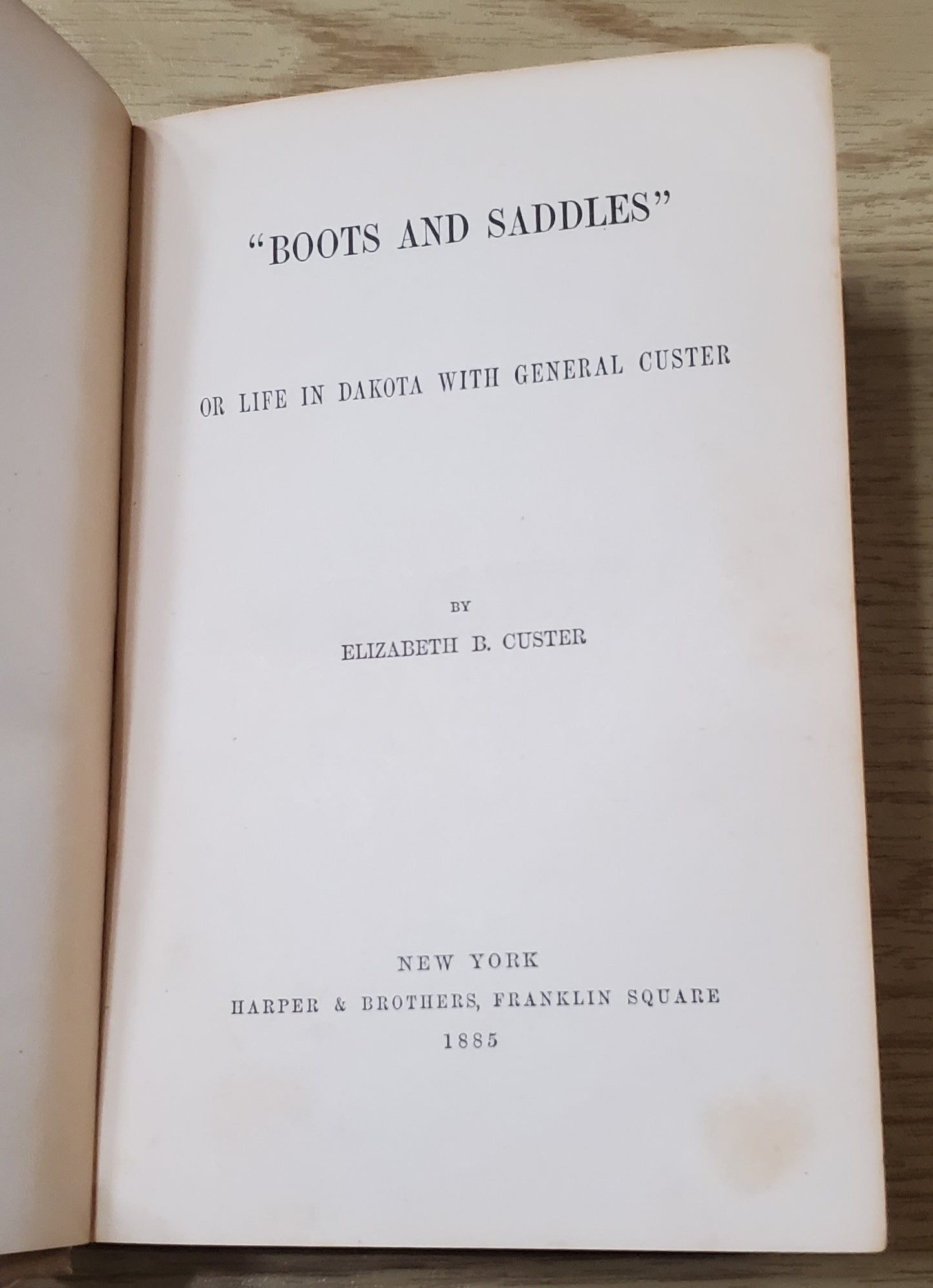 Custer, Elizabeth. Boots and Saddles. NY: Harper & Bros, 1885. 1st ed, 1st issue without a frontis or map. Pict cloth, gilt. Spine lean. Fraying, Cloth frayed. Bottom ½” spine soiled. Good