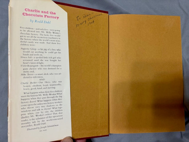 Dahl, Roald.  Charlie and the Chocolate Factory. NY: Alfred Knopf, (1964). 1st ed, 1st printing with red cloth, top edge brown and 6-line collophon on last page. 1st issue DJ with no ISBN number on rear panel Book is Near mint, DJ only Fair