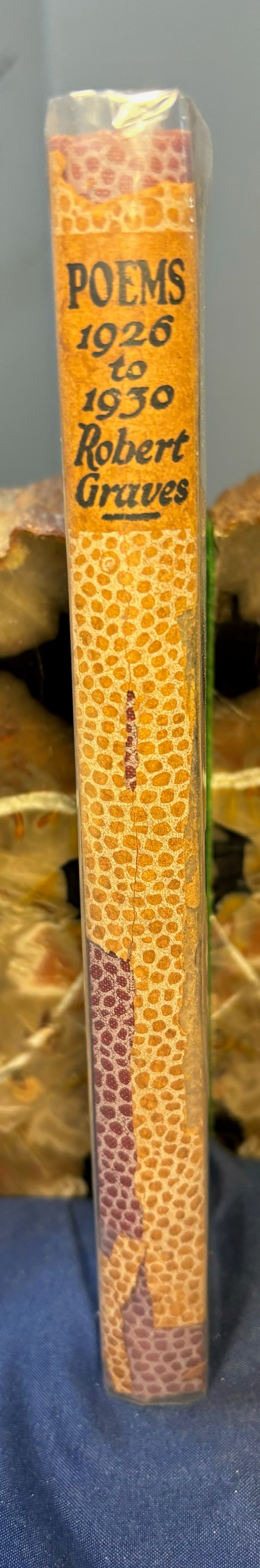 Graves, Robert. Poems (1926 - 1930). London: William Heineman, 1931. 1st ed. 1/2 x 3" chip to DJ spine.F/VG