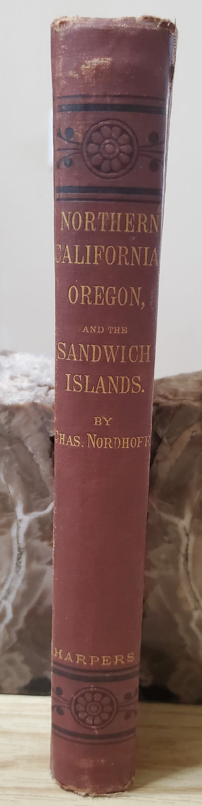 Nordhoff, Charles. Northern California, Oregon and the Sandwich Islands. 1874. 1st ed. Illus. Cloth, gilt. Cloth frayed, rubbed, bb-sized hole through first four pages, bookplate removed. VG