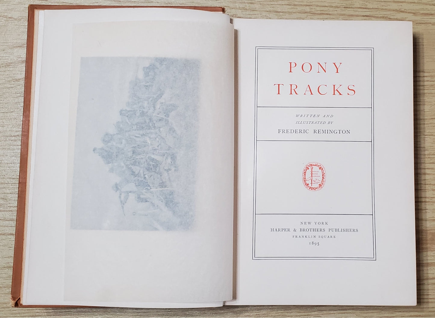 Remington, Frederick. Pony Tracks. NY: Harper &amp; Bros, 1895. 1st ed. Pict cloth, gilt. Hinges broken, spine lean, fraying, some rubbing. VG