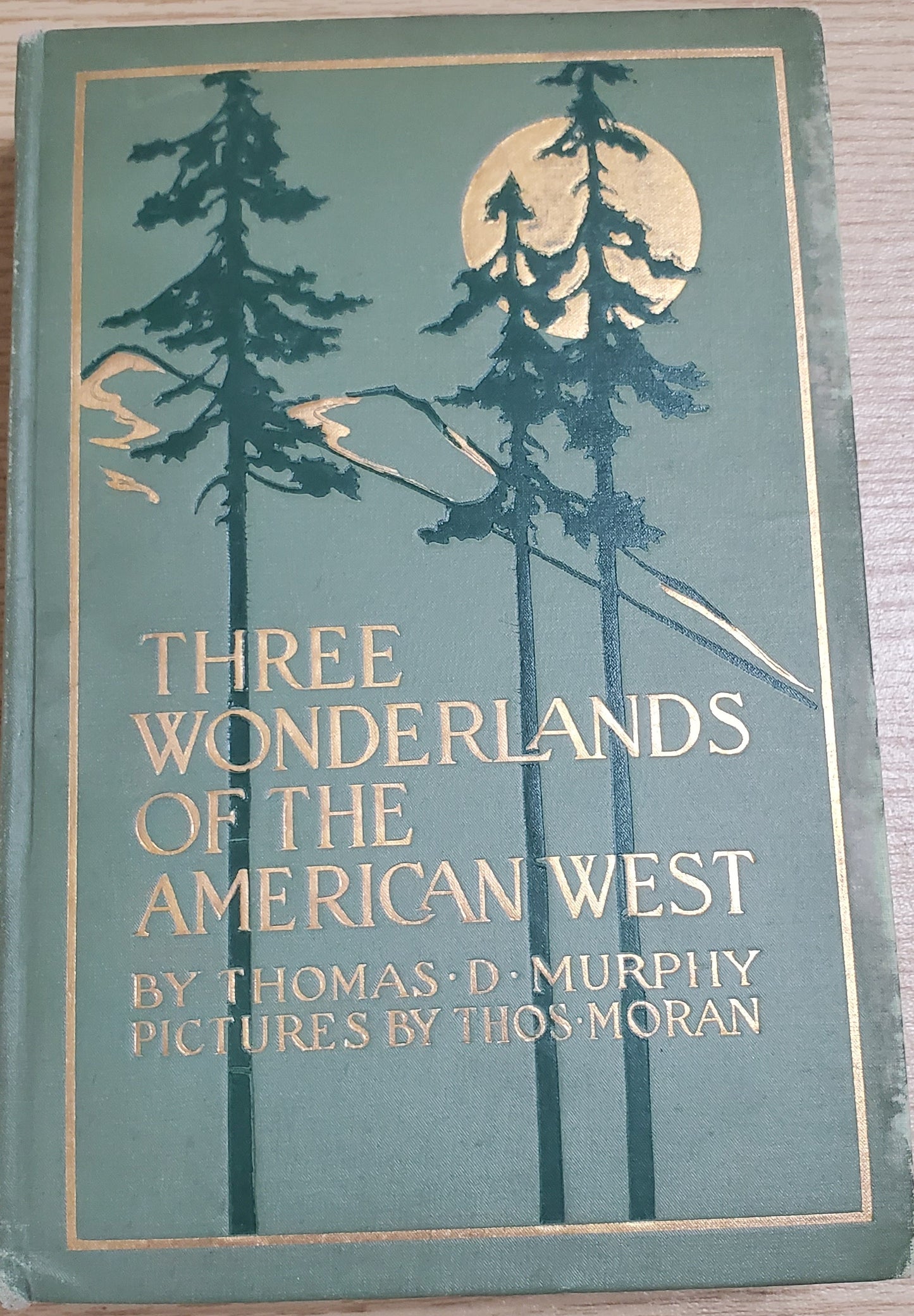 Murphy, Thomas Three Wonderlands of the American West. Boston: Page, 1912. 1st ed.&nbsp; Color plates by Thomas Moran. Discoloration along board edges, small clipping pasted on endpaper. Pict cloth, gilt. VG